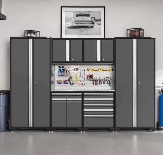 wall of gray steel cabinets with inset slatwall holding tools