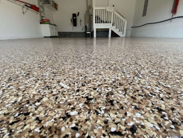 close look at a garage floor finished in a polka-dotted poly flake style