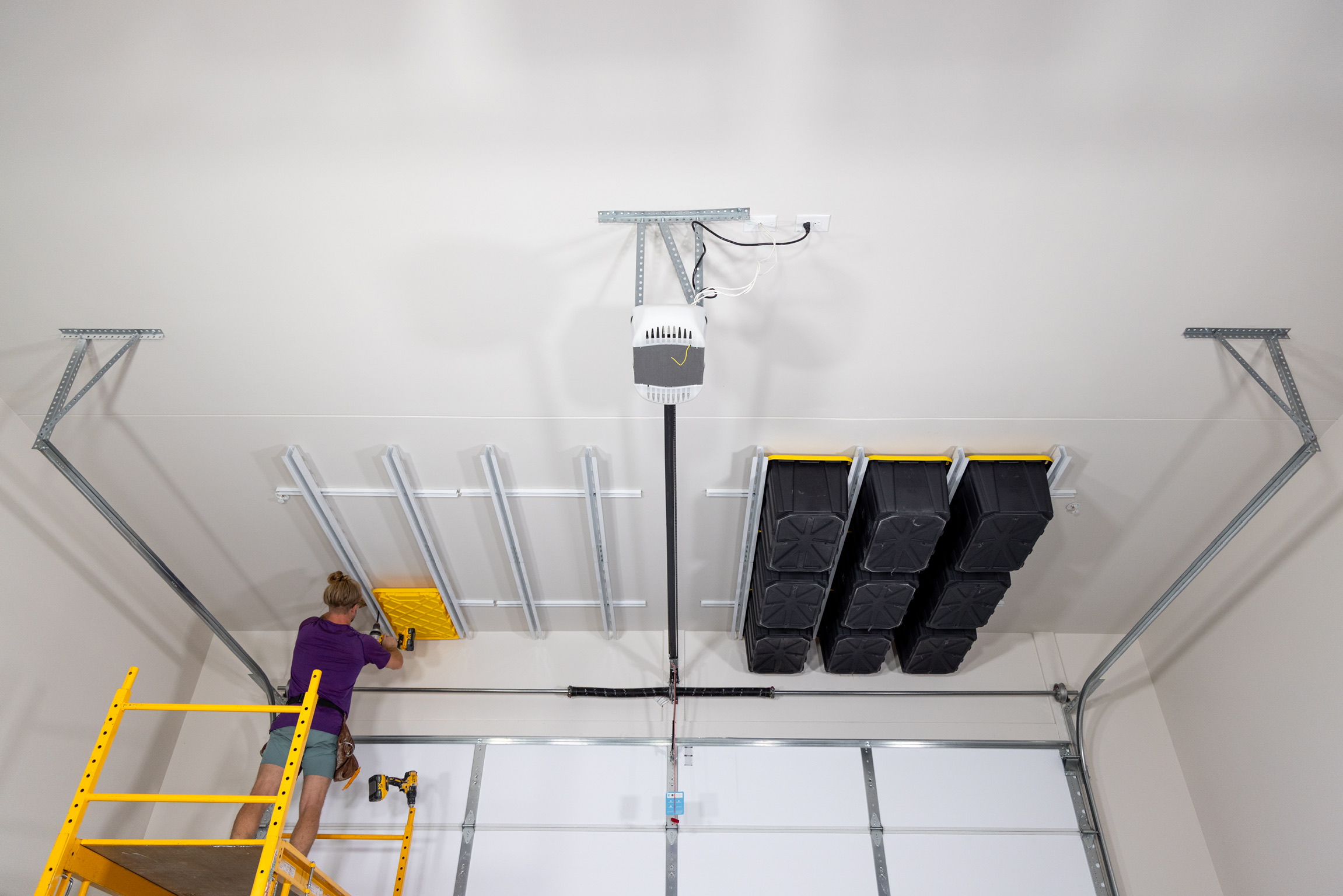 Bins organized by category overhead