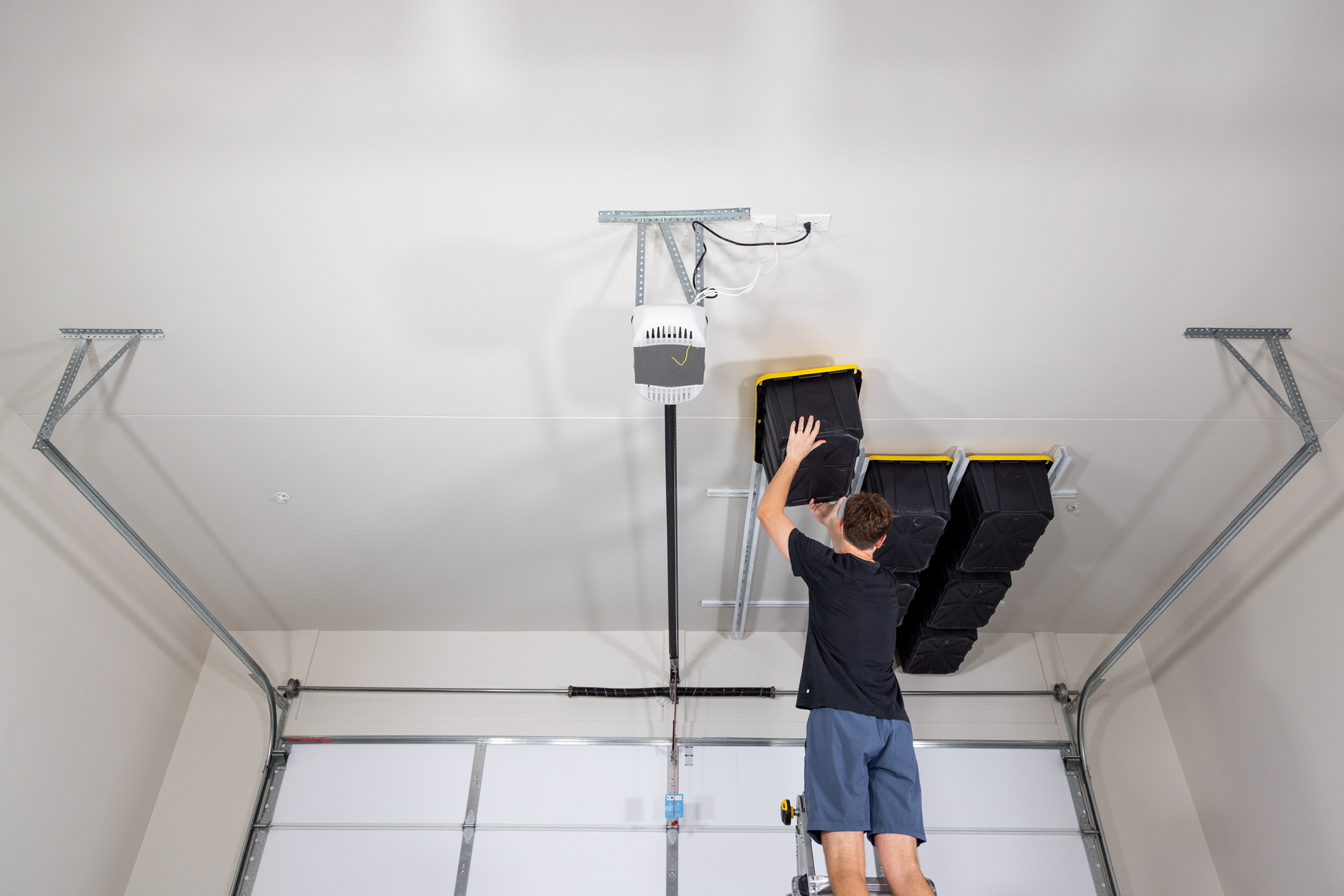 Sliding overhead storage for bins and totes