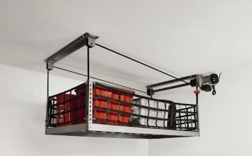 a hand-cranked overhead storage bin pulled up to the ceiling to create more floor space